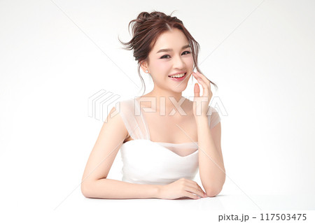 Beautiful young asian woman with clean fresh skin on white background, Face care, Facial treatment, Cosmetology, beauty and spa, Asian women portrait. Beautiful young asian woman with clean fresh skin on white background, Face care, Facial treatment, Cosmetology, beauty and spa, Asian women portrait. 117503475