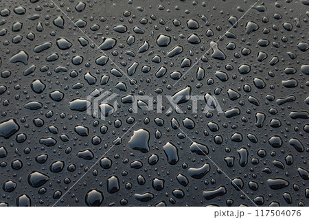water droplets on black surface, abstract textured background water droplets on black surface, abstract textured background 117504076