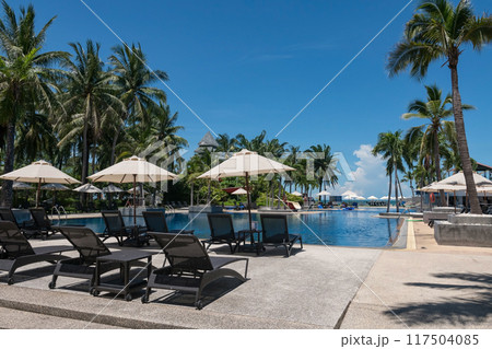 Bedchair at swimming pool by tropical sea in summer , Hua Hin 117504085