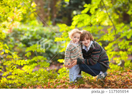 Kids play in autumn park 117505054
