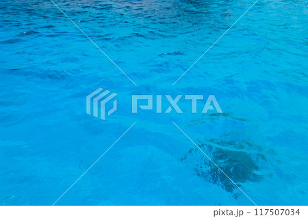 Blue water texture background. Surface of sea or ocean Blue water texture background. Surface of sea or ocean 117507034