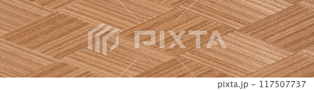 Intricate chevron pattern in natural wood veneer with rich brown hues 117507737