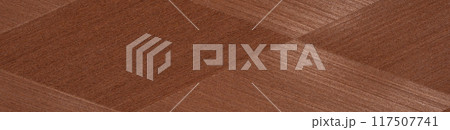 Rich mahogany veneer in a herringbone design with a luxurious polished finish 117507741