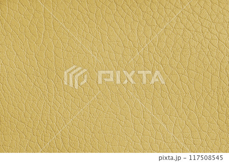 Texture of genuine leather or artificial synthetic leatherette yellow color background 117508545