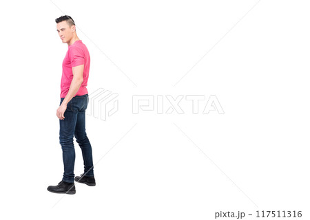 Self assured flirting man in studio. White background 117511316