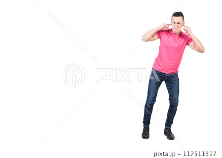 Dissatisfied man covering ears from noise. White background 117511317