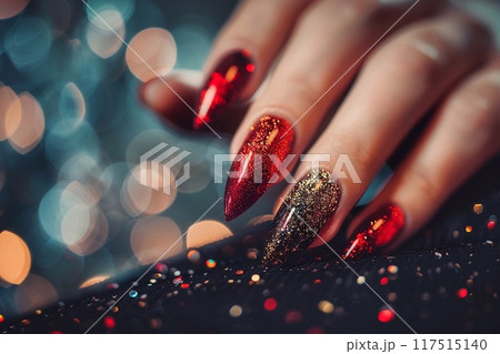 Hand with dark red manicure and glitter 117515140
