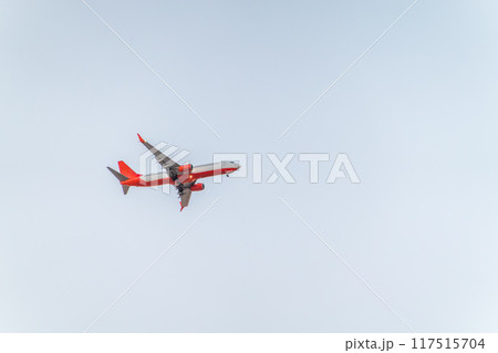 Airplane before landing in blue sky, Boeing 737-800 Airplane before landing in blue sky, Boeing 737-800 117515704