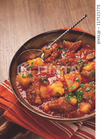 Potatoes with meat, stewed in tomato sauce, with spices and herbs, homemade, no people, 117515778