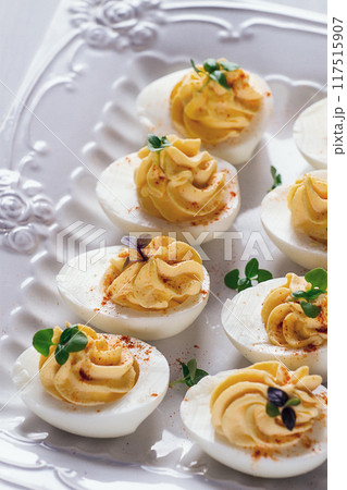 Boiled eggs stuffed with yolk with mayonnaise, on a white plate, selective focus, blurry, close-up, no people, Boiled eggs stuffed with yolk with mayonnaise, on a white plate, selective focus, blurry, close-up, no people, 117515907