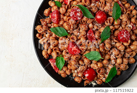 Tuscan pasta with smoked paprika and basil,parmesan cheese, Italian traditional cuisine, Tuscan pasta with smoked paprika and basil,parmesan cheese, Italian traditional cuisine, 117515922