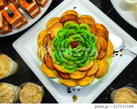 Fruit Cake with Peach and Kiwi Slices 117517104