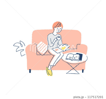 ソファーに座って雑誌を見ながらコーヒを飲んでいる女性 117517201