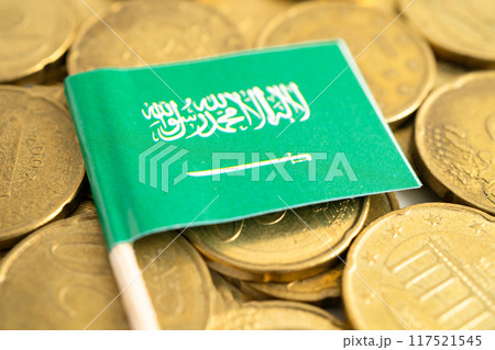 Saudi arabia flag on gold coins, finance and banking business. 117521545