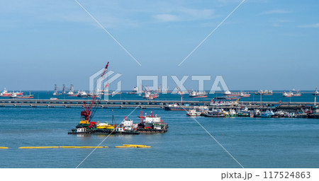 Logistic shipping quay boat Engineering crane depot at logistic export terminal control. Warehouse freight background container yard loading quayside harbor port. Logistics seascape shipping portal 117524863