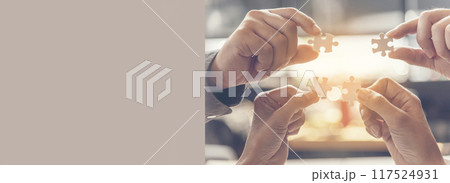 Banner Implement puzzle improve hand holding together solve synergy organize team connection plan trust strategy. Stakeholder business trust teams hands holding jigsaw puzzle synergy with copy space 117524931