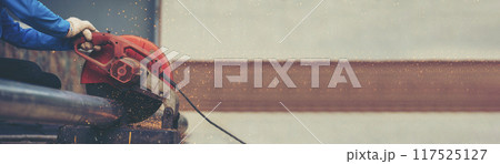 Banner Men hands wear protective glove Hot flame metal work cut fire iron workshop. Locksmith cut metal process. Construction Worker hands using Welding machinery iron metal sparking with copy space Banner Men hands wear protective glove Hot flame metal work cut fire iron workshop. Locksmith cut metal process. Construction Worker hands using Welding machinery iron metal sparking with copy space 117525127