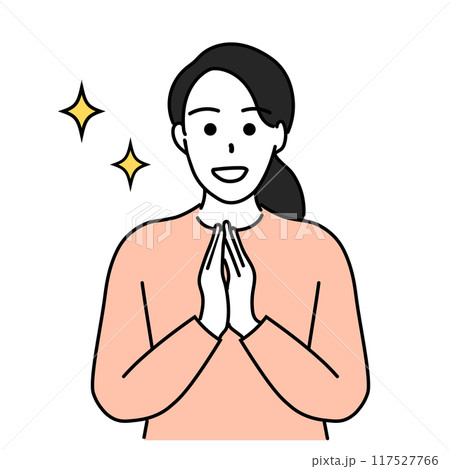 手を合わせて喜ぶ若い女性 117527766