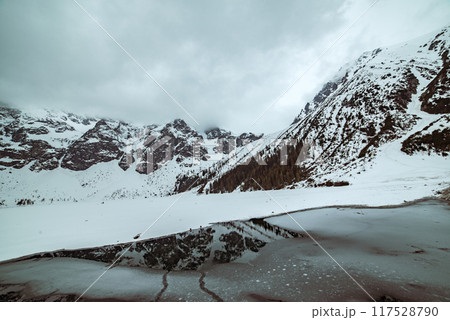 Frozen Lake Morskie Oko or Sea Eye Lake in Poland at Winter. Frozen Lake Morskie Oko or Sea Eye Lake in Poland at Winter. 117528790