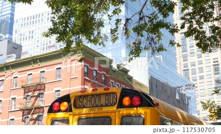 Yellow School Bus on New York Manhattan street, schoolbus truck on USA city road. Children education Yellow School Bus on New York Manhattan street, schoolbus truck on USA city road. Children education 117530705