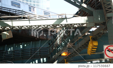 New York City elevated subway, metropolitan bridge, metro train track above street. Railway transport 117530887
