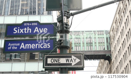 New York City crossroad, street intersection road sign. 6 Sixth ave, Americas avenue. Gimbels Bridge New York City crossroad, street intersection road sign. 6 Sixth ave, Americas avenue. Gimbels Bridge 117530904