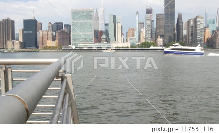 New York City waterfront skyline, Manhattan Midtown riverfront skyscrapers. Cityscape from Queens. New York City waterfront skyline, Manhattan Midtown riverfront skyscrapers. Cityscape from Queens. 117531116