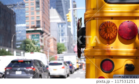 Yellow School Bus on New York Manhattan street, schoolbus truck on USA city road. Children education Yellow School Bus on New York Manhattan street, schoolbus truck on USA city road. Children education 117531251
