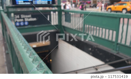 New York subway sign, underground metro station. Metropolitan entrance fence, 34 street Penn Station 117531419