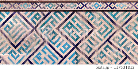 Vertical or horizontal background with detail of ancient mosaic walls with clay details and geometric ceramic tile ornament. Traditional iranian tile decorations 117531812