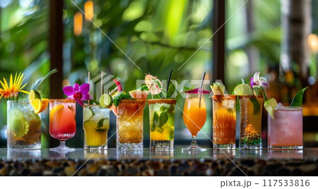 Assortment of colorful exotic alcoholic cocktails served in glasses with garnishes 117533816