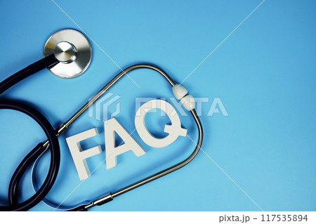 FAQ with wooden blocks alphabet letters and stethoscope on blue background FAQ with wooden blocks alphabet letters and stethoscope on blue background 117535894