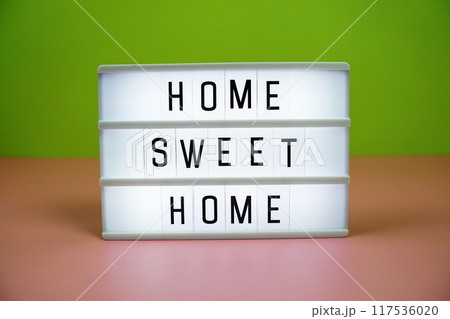 Home Sweet Home letterboard text on LED Lightbox on pink and green background Home Sweet Home letterboard text on LED Lightbox on pink and green background 117536020