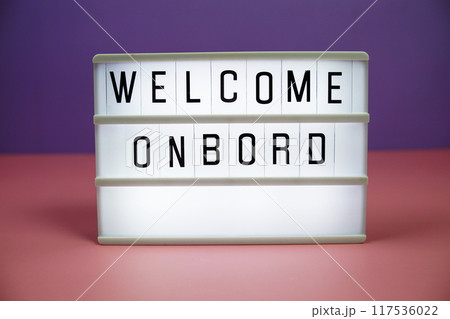 Welcome Onboard letterboard text on LED Lightbox on pink and purple background Welcome Onboard letterboard text on LED Lightbox on pink and purple background 117536022