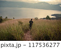 Each step is a dance with the wind in the golden sea of grass 117536277