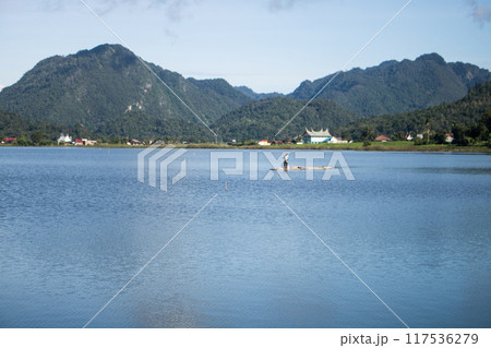 The wind in his hair, the sun on his face 117536279