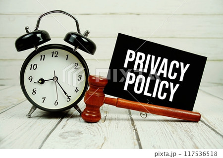 Privacy Policy text on paper card with alarm clock and wooden judge gavel on wooden background Privacy Policy text on paper card with alarm clock and wooden judge gavel on wooden background 117536518