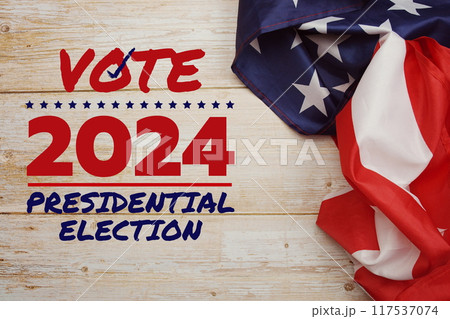 Vote 2024, Presidential Election with USA American flag on wooden background 117537074