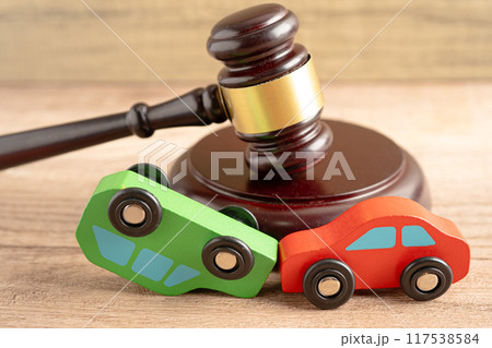 Hammer gavel judge with car vehicle accident, insurance coverage claim lawsuit court case. 117538584