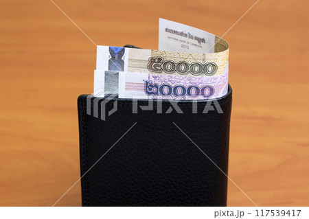 Cambodian riel in the black wallet Cambodian riel in the black wallet 117539417