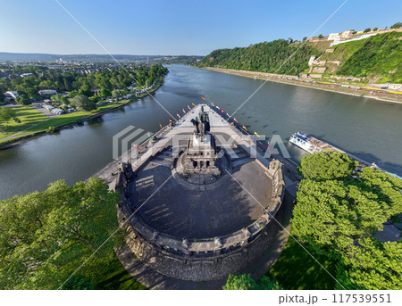 Deutsches Eck or German Corner headland in Koblenz, where the Mosel river joins the Rhine. Aerial 5k shot 117539551