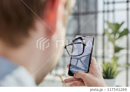 man relaxing surfing on internet in free time. 117541269