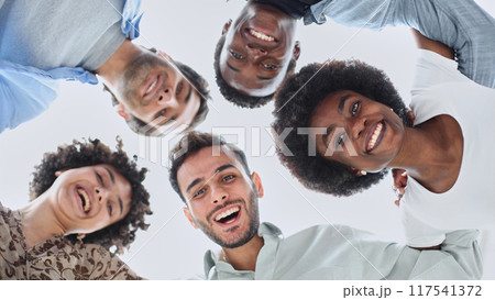 Closeup portrait, bottom view, happy faces of different team employees standing in circle Closeup portrait, bottom view, happy faces of different team employees standing in circle 117541372