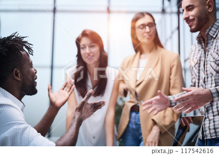Shot of a group of businesspeople sitting together in a meeting. 117542616