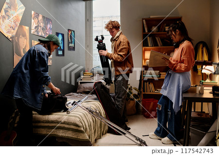 Preparing Filming Equipment in Creative Studio Space Preparing Filming Equipment in Creative Studio Space 117542743