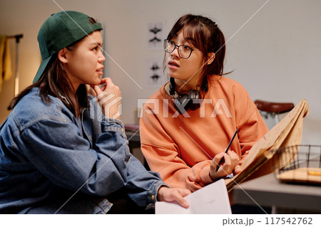 Discussing Design Ideas in Art Studio Discussing Design Ideas in Art Studio 117542762