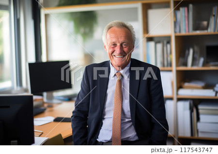 Smiling 70-Year-Old Gentleman in a Welcoming Office Smiling 70-Year-Old Gentleman in a Welcoming Office 117543747