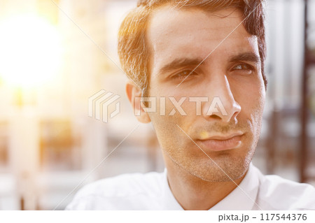 close-up, portrait of a serious businessman on the background of the office 117544376