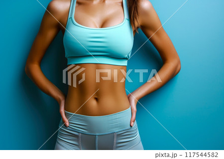 Bold and Beautiful: Female Athlete's Waist in Vibrant Sportswear 117544582