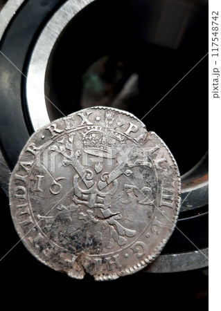 Patagon old coin lying on bearing. Silver thaler brabant Spanish Netherlands 1632 King Philip IV 117548742